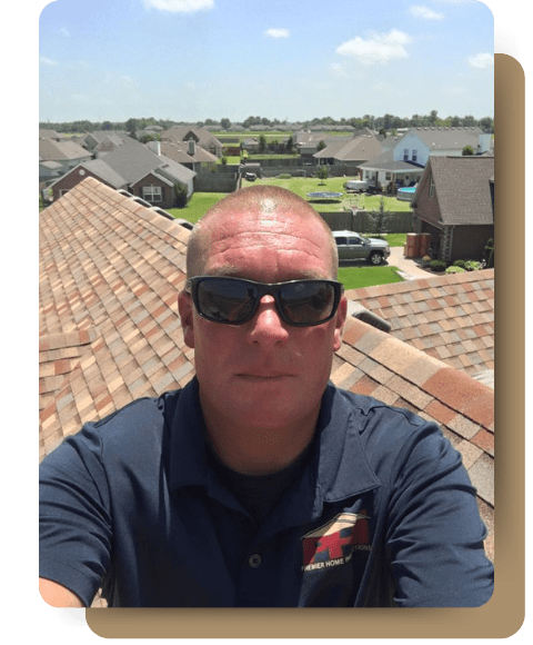 Premier Home Inspections owner Derek Gander inspecting a roof